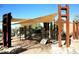 Inviting community playground with modern play structures, shade canopies, and secure soft ground cover at 9248 E Desert Village Dr, Scottsdale, AZ 85255