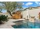 Backyard pool with sauna, landscape, and privacy wall, great for entertaining at 9248 E Desert Village Dr, Scottsdale, AZ 85255