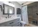 Updated bathroom with gray tile shower and modern vanity at 9614 W Long Hills Dr, Sun City, AZ 85351