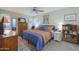 Relaxing bedroom with a king-size bed and built-in shelving at 9614 W Long Hills Dr, Sun City, AZ 85351