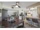 Open dining area with kitchen views and a dark wood table at 9614 W Long Hills Dr, Sun City, AZ 85351