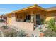 Inviting front porch with decorative planters and lighting at 9614 W Long Hills Dr, Sun City, AZ 85351