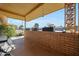 Covered porch with brick wall and view of the neighborhood at 9614 W Long Hills Dr, Sun City, AZ 85351