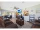 Open living room featuring hardwood floors and a view of the kitchen at 9614 W Long Hills Dr, Sun City, AZ 85351