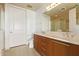 Bathroom with double sinks and a large mirror at 1 E Lexington Ave # 908, Phoenix, AZ 85012