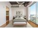 Main bedroom with hardwood floors and city views at 1 E Lexington Ave # 908, Phoenix, AZ 85012