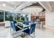 Modern dining area with blue chairs and a glass-top table at 1 E Lexington Ave # 908, Phoenix, AZ 85012