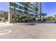 Modern high-rise building with palm trees and city views at 1 E Lexington Ave # 908, Phoenix, AZ 85012
