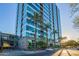 Modern high-rise building with palm trees and city views at 1 E Lexington Ave # 908, Phoenix, AZ 85012