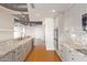 Modern kitchen with granite countertops and gray cabinets at 1 E Lexington Ave # 908, Phoenix, AZ 85012