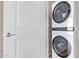 Modern laundry room with stacked LG washer and dryer at 1 E Lexington Ave # 908, Phoenix, AZ 85012