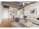 Spacious living room featuring hardwood floors and built-in cabinetry at 1 E Lexington Ave # 908, Phoenix, AZ 85012