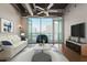 Bright living room with city views and floor-to-ceiling windows at 1 E Lexington Ave # 908, Phoenix, AZ 85012