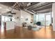 Open living area with hardwood floors, city views, and modern furniture at 1 E Lexington Ave # 908, Phoenix, AZ 85012