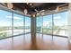 Spacious living room featuring hardwood floors and expansive windows at 1 E Lexington Ave # 908, Phoenix, AZ 85012