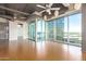 Bright living room with hardwood floors and stunning city views at 1 E Lexington Ave # 908, Phoenix, AZ 85012