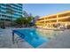 Spacious community pool with plenty of lounge chairs at 1 E Lexington Ave # 908, Phoenix, AZ 85012
