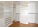 Large walk-in closet with ample shelving and drawers at 1 E Lexington Ave # 908, Phoenix, AZ 85012