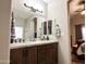 Bathroom with granite countertops, double sinks, and a large mirror at 10315 W Rosemead Dr, Casa Grande, AZ 85194