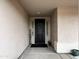 Front entry with dark-stained door and welcome sign at 10315 W Rosemead Dr, Casa Grande, AZ 85194