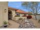 Landscaped front yard with a walkway leading to the entrance at 10508 E Mission Ln, Scottsdale, AZ 85258