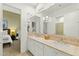 Modern bathroom with double sinks and a view into bedroom at 11127 E Mirasol Cir, Scottsdale, AZ 85255