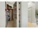 Large walk-in closet with custom shelving and drawers at 11127 E Mirasol Cir, Scottsdale, AZ 85255