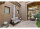 Private courtyard with seating area and access to interior at 11127 E Mirasol Cir, Scottsdale, AZ 85255