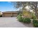 Stunning desert home with 3-car garage, mature landscaping, and a long driveway at 11127 E Mirasol Cir, Scottsdale, AZ 85255