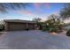 Three car garage, desert landscaping and gated entry at 11127 E Mirasol Cir, Scottsdale, AZ 85255