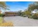Three-car garage with ample driveway parking at 11127 E Mirasol Cir, Scottsdale, AZ 85255