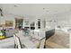 Modern kitchen with white cabinets, large island, and breakfast area at 11127 E Mirasol Cir, Scottsdale, AZ 85255