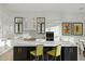 Modern kitchen with white cabinets, large island, and high-end appliances at 11127 E Mirasol Cir, Scottsdale, AZ 85255