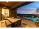Outdoor dining patio with views of the pool and mountains at 11127 E Mirasol Cir, Scottsdale, AZ 85255