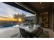 Covered patio with outdoor dining and sunset views at 11127 E Mirasol Cir, Scottsdale, AZ 85255