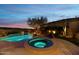 Stunning pool and spa at dusk with mountain views at 11127 E Mirasol Cir, Scottsdale, AZ 85255