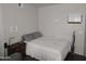 Bedroom with a double bed, nightstand, and vacuum cleaner at 12221 W Bell Rd # 259, Surprise, AZ 85378