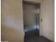 Modern elevator in a light beige hallway at 12221 W Bell Rd # 259, Surprise, AZ 85378