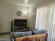 Living room with TV, couch, and floor lamp at 12221 W Bell Rd # 259, Surprise, AZ 85378