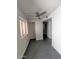 The open living area features tile flooring, neutral walls, and a ceiling fan at 12221 W Bell Rd # 259, Surprise, AZ 85378