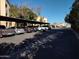 Covered parking area with several cars parked under shade at 12221 W Bell Rd # 259, Surprise, AZ 85378