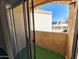 View from a patio featuring green turf and exterior building view at 12221 W Bell Rd # 259, Surprise, AZ 85378