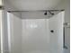 Clean and simple shower area with white walls and tile flooring at 12221 W Bell Rd # 259, Surprise, AZ 85378