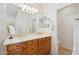 Double vanity bathroom with light wood cabinets and tiled floors at 12333 W Fetlock Trl, Peoria, AZ 85383