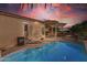 Relaxing pool and patio area at sunset at 12333 W Fetlock Trl, Peoria, AZ 85383