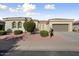 Single-story home with stucco exterior, two-car garage, and landscaped front yard at 13148 W Figueroa Dr, Sun City West, AZ 85375