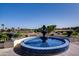 Elegant fountain centerpiece with a tranquil water feature, overlooking a scenic golf course at 13148 W Figueroa Dr, Sun City West, AZ 85375