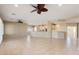 Spacious living room with tile floors and ceiling fans at 13148 W Figueroa Dr, Sun City West, AZ 85375