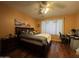 Spacious bedroom with wood floors and large window at 13594 W Port Royale Ln, Surprise, AZ 85379