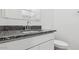 Bathroom boasts granite countertop, single sink vanity, and toilet at 1543 E Lardner Dr, Casa Grande, AZ 85122